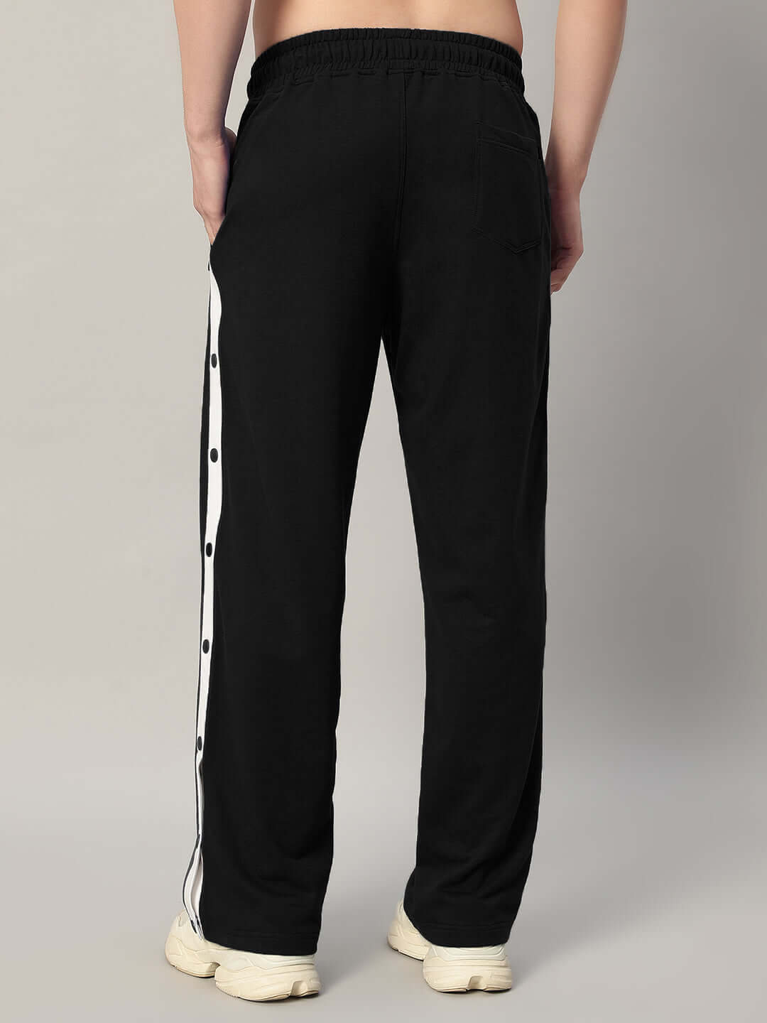Back view of EZEL Relaxed Fit Jogger in black with white striped detail, showcasing the comfortable and tailored fit.