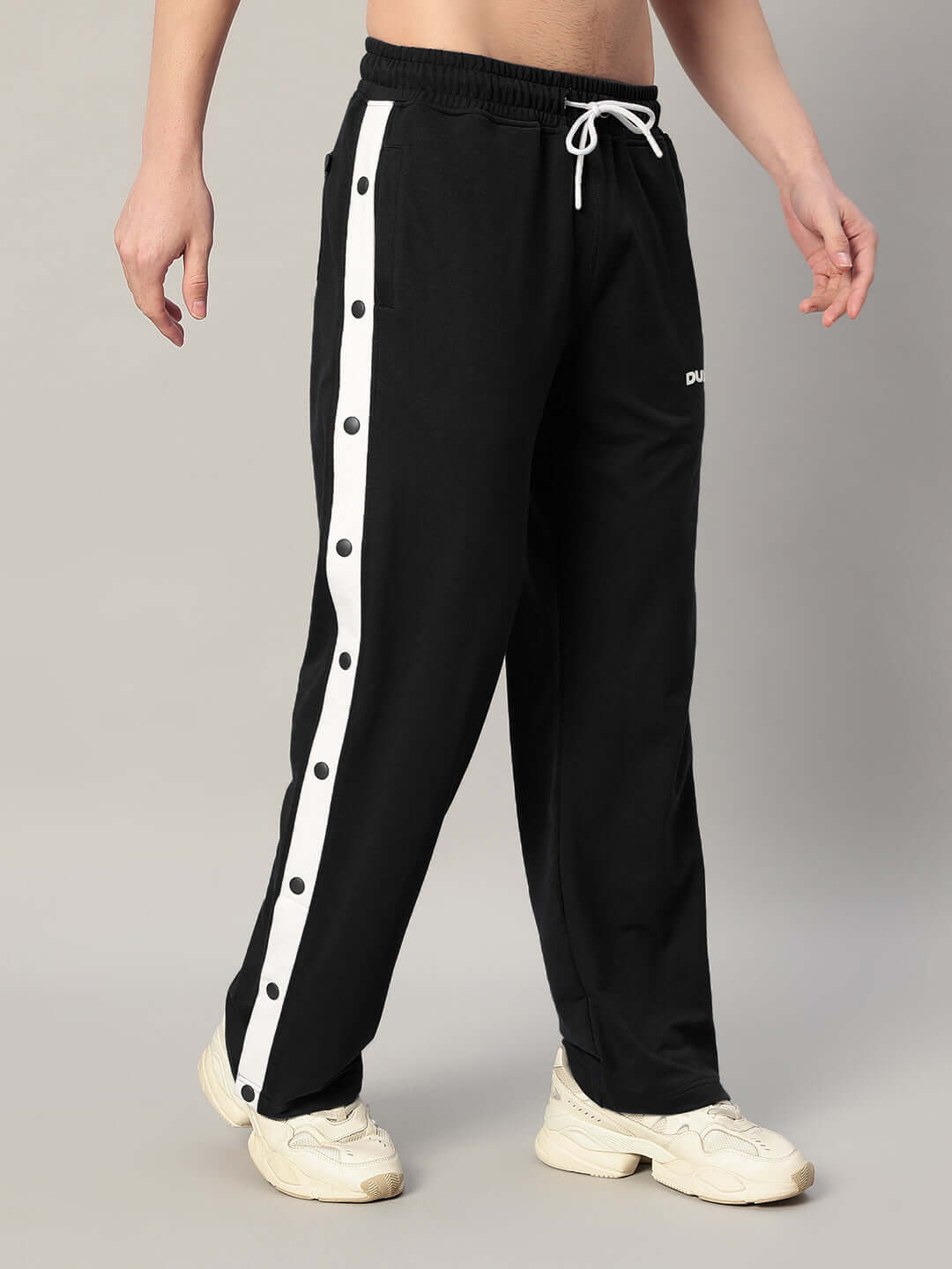 Black relaxed fit jogger with white side stripe, customizable fit, perfect for casual wear.