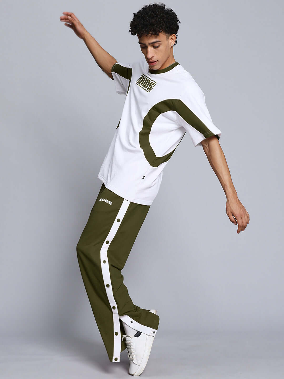 Model wearing EZEL RELAXED FIT CO-ORD SET WHITE-OLIVE showcasing comfortable and stylish design in premium cotton-blend fabric.