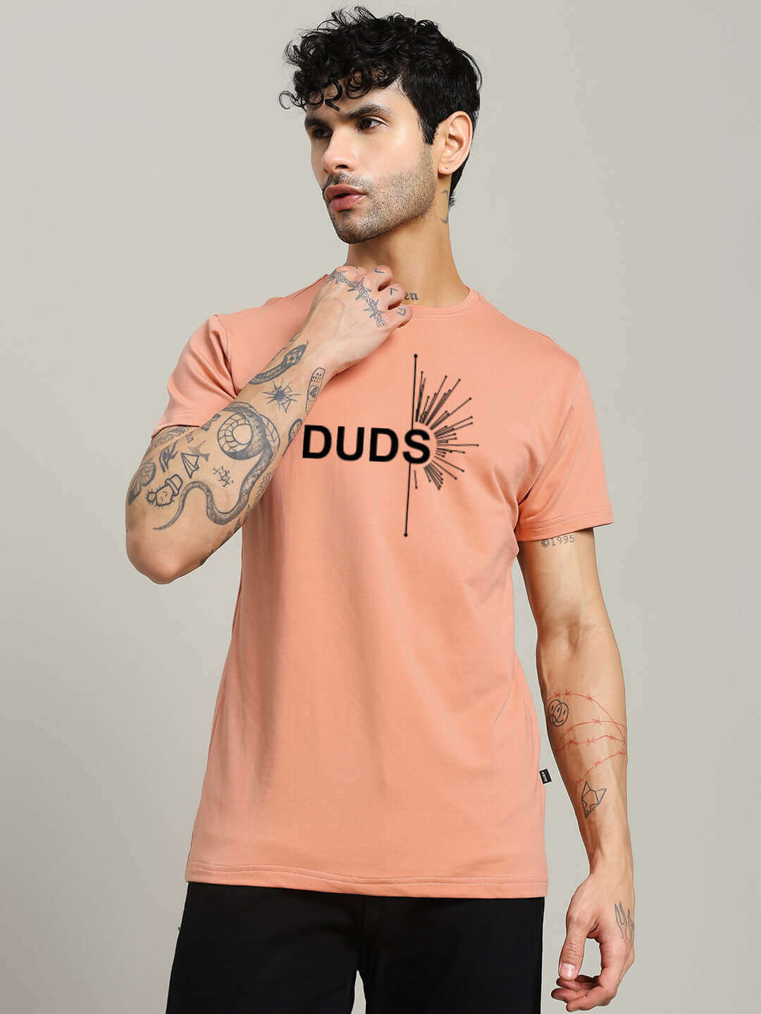 Fallen Angle Regular Fit Peach T-Shirt, premium heavy gauge 100% cotton, bio-washed, model wearing black pants, stylish design