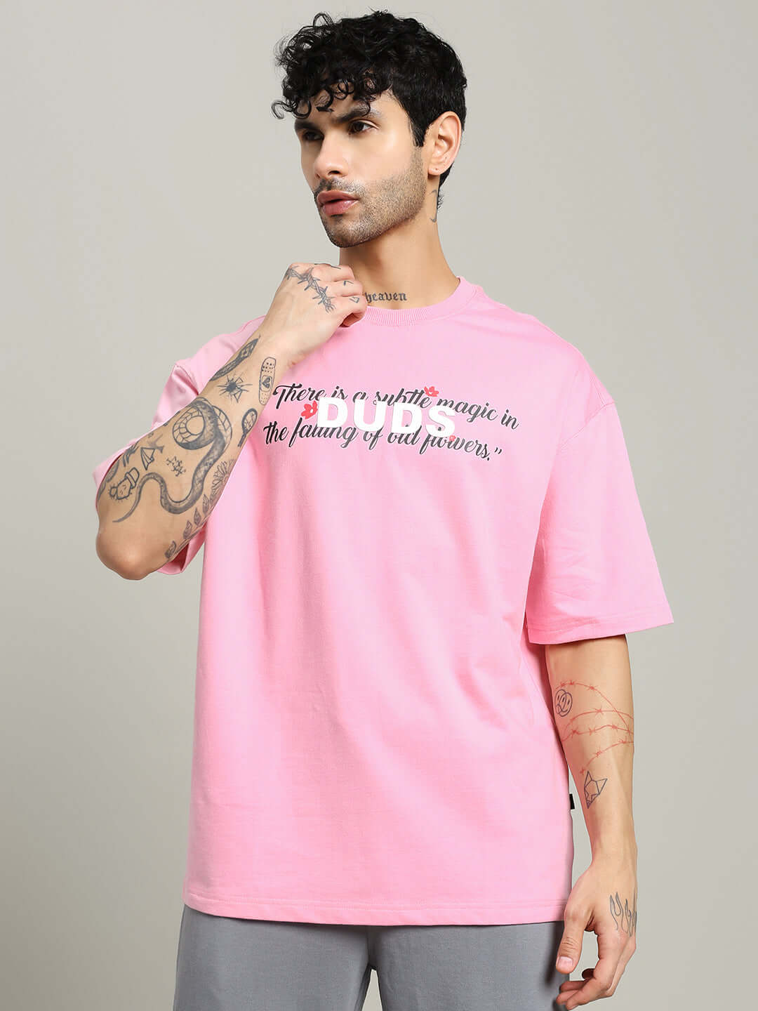 Model wearing FALLING FLOWER T-SHIRT PINK, premium cotton blend, casual style, relaxed fit, elegant design.