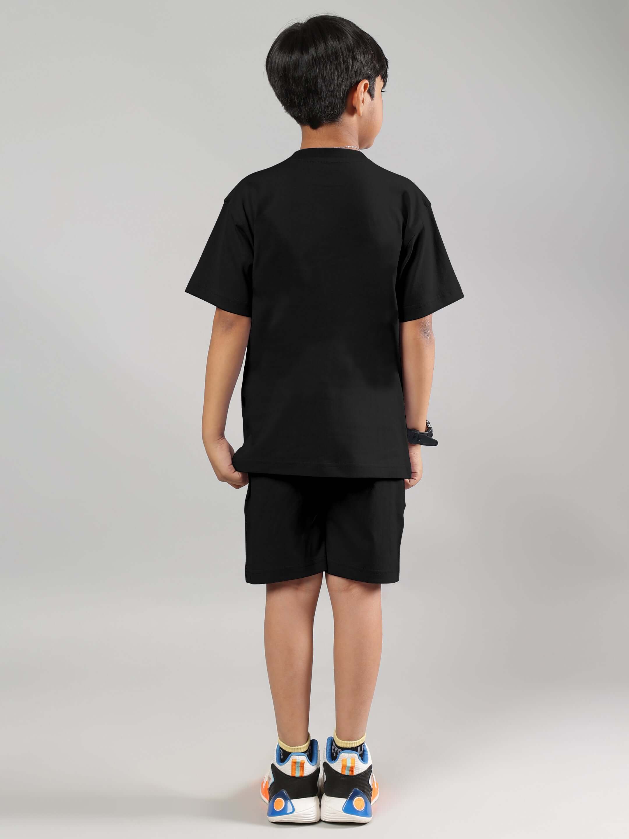 Child wearing black Fancy Dream Co-Ord outfit, customizable size options available for boys and girls.