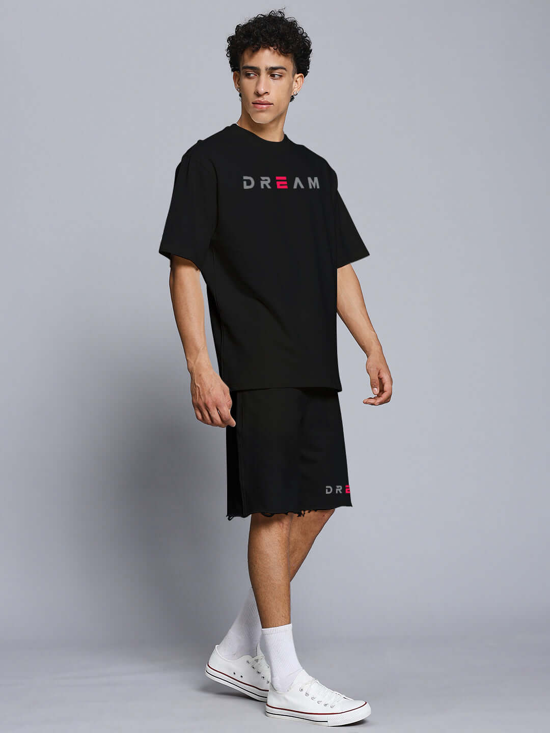 Model wearing Fancy Dream Co-ord Set in black made of premium cotton and elastane, featuring a relaxed fit and bold text design.