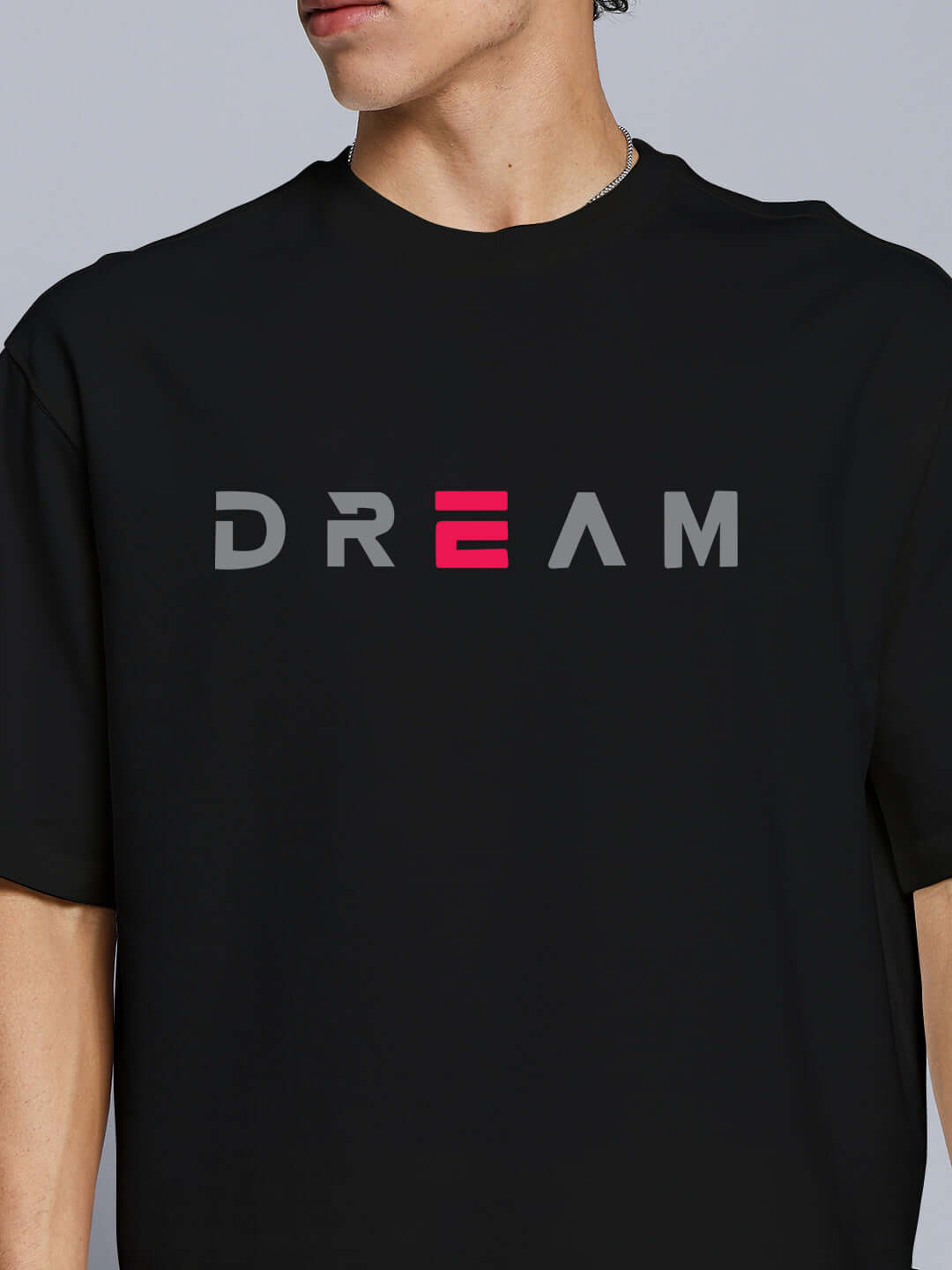 Man wearing black t-shirt with 'DREAM' text, part of Fancy Dream Co-ord Set, cotton blend, perfect for casual wear.