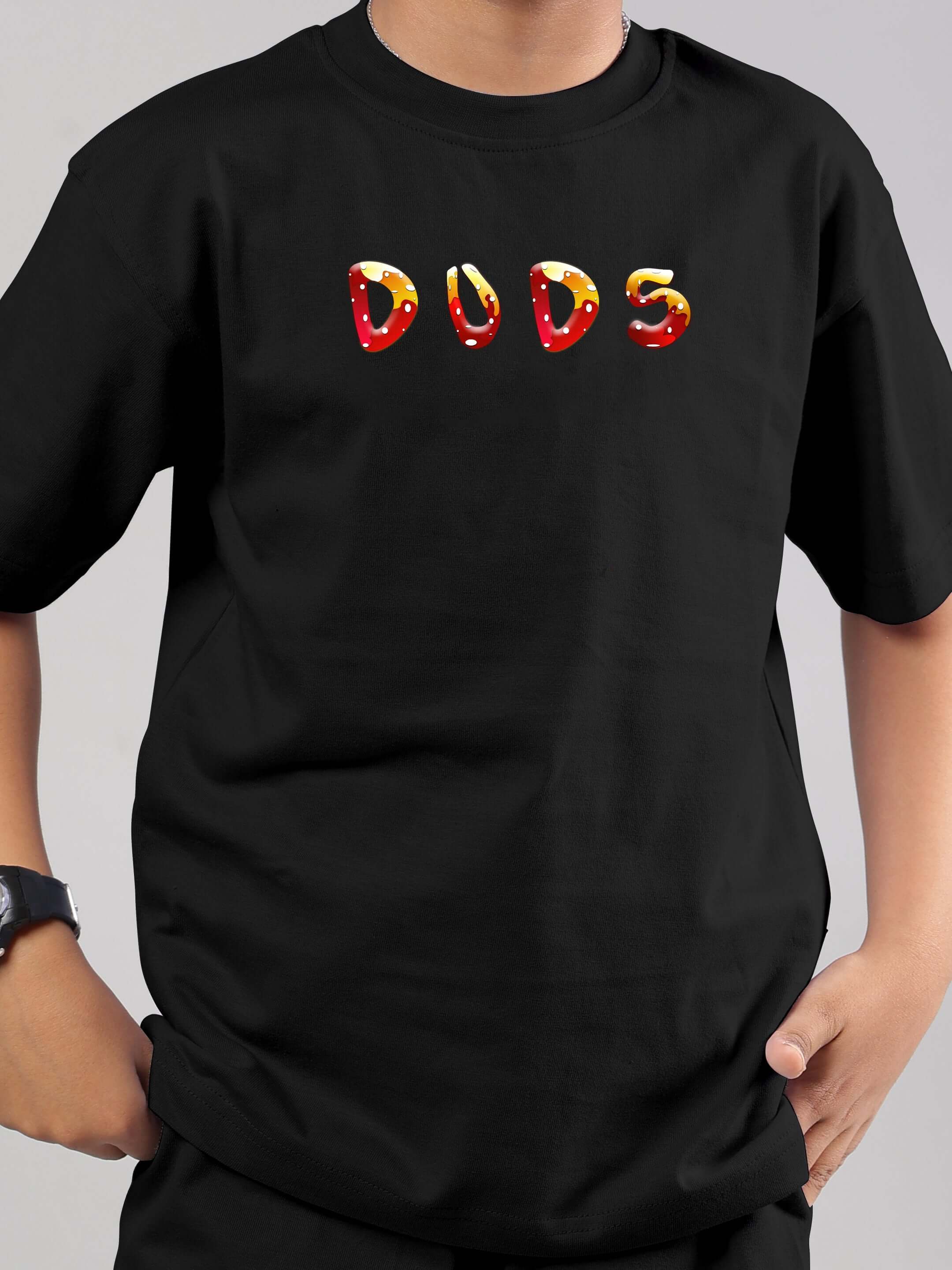Boy wearing black fantasy mushroom t-shirt with 'DUDS' logo, suitable for boys and girls.