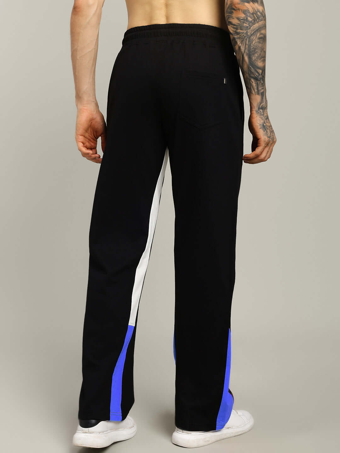 Back view of model wearing Fearless Contrast Positive Relaxed Fit Joggers in black-blue with white stripes. Custom fit options available.