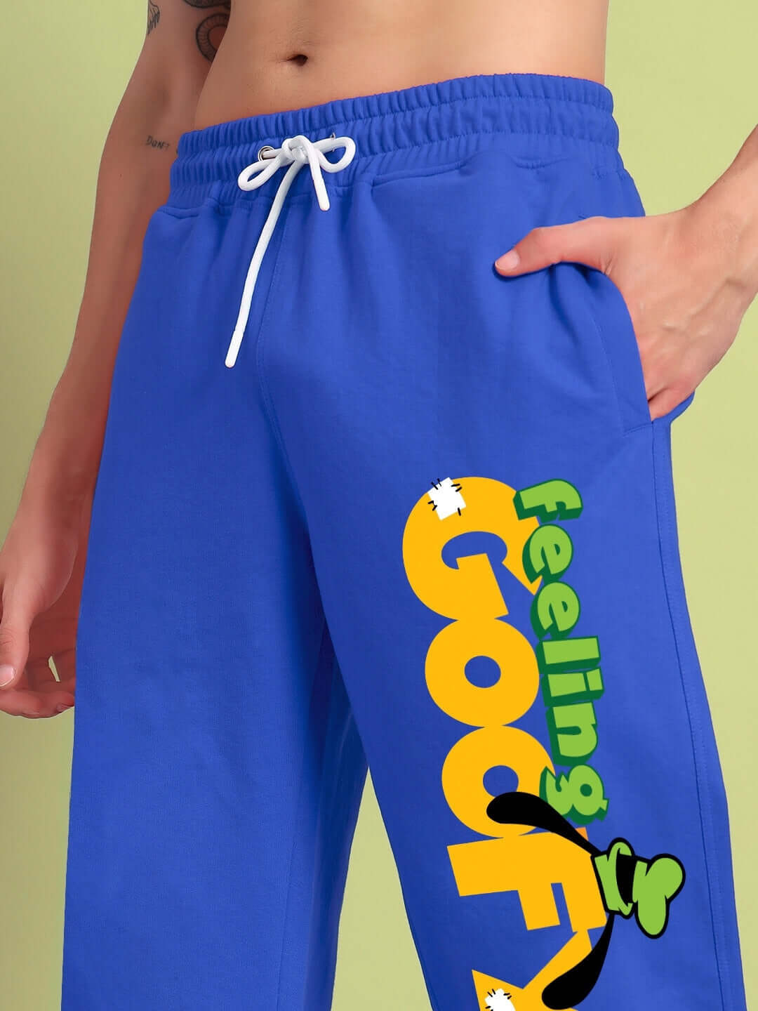 FEELING GOOFY RELAXED FIT JOGGER BLUE with cartoon print, vibrant blue color, cotton blend fabric, comfortable streetwear pants.