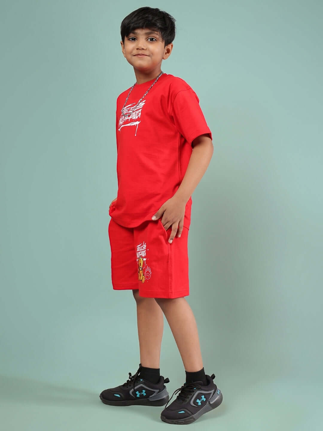 Boy wearing FEELS NOTHING CO-ORD FOR BOYS & GIRLS RED set with designs, showcasing trendy fashion. Custom fit available for personalized sizing.