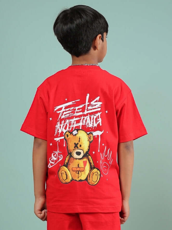 Child wearing FEELS NOTHING T-SHIRT FOR BOYS GIRLS RED with bear graphic on the back
