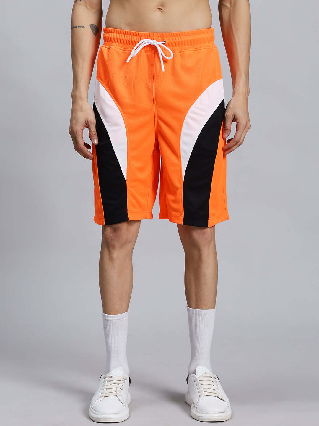 FIFA COLORBLOCK CO-ORD SET ORANGE in orange with black and white accents, made from sports polyester, featuring elastic waist and drawstring.