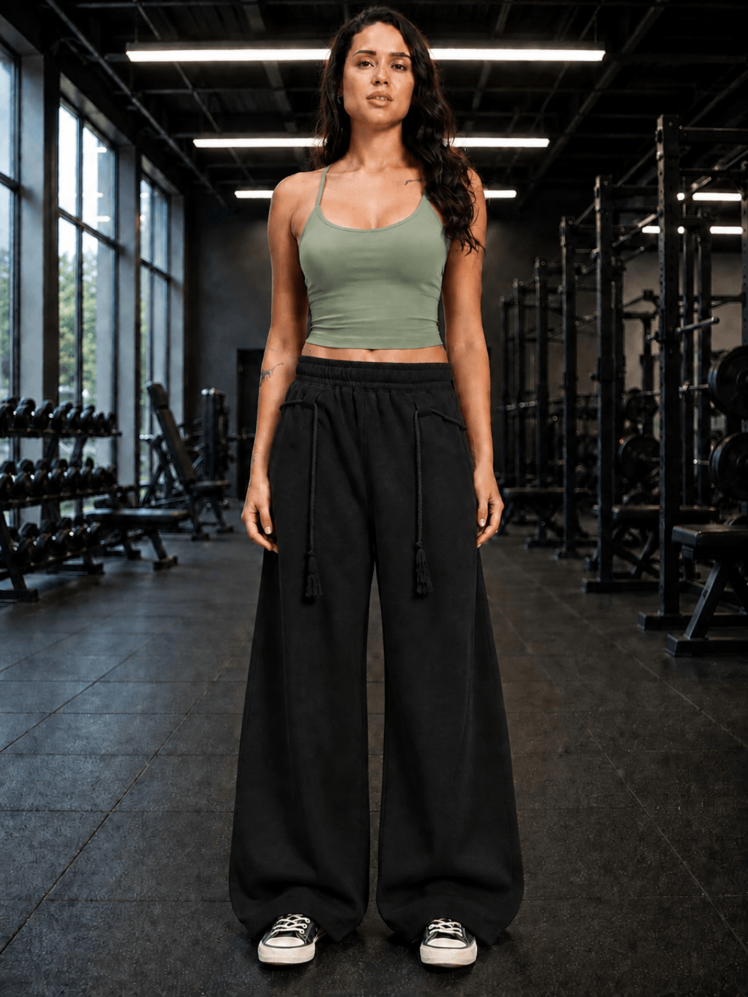 WOMEN SEAMLESS COTTON CROP-TOP OLIVE GREEN styled with black wide-leg pants in a gym setting.