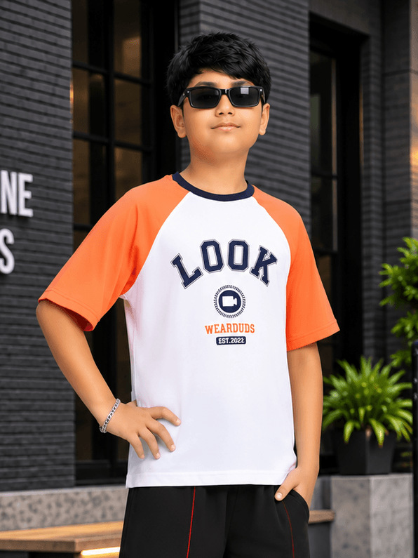 STREET CLUB T-SHIRT BOYS GIRLS WHITE ORANGE worn by a boy outdoors, featuring stylish orange and white design.