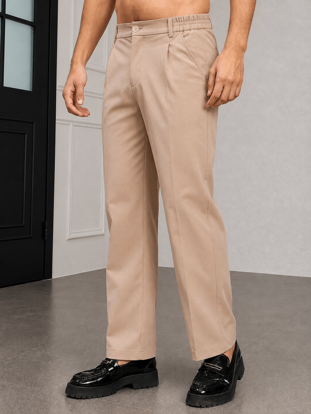 HIGH-FLEX TAILORED PANTS BEIGE worn by a man featuring a clean streamlined silhouette and flexible comfort.