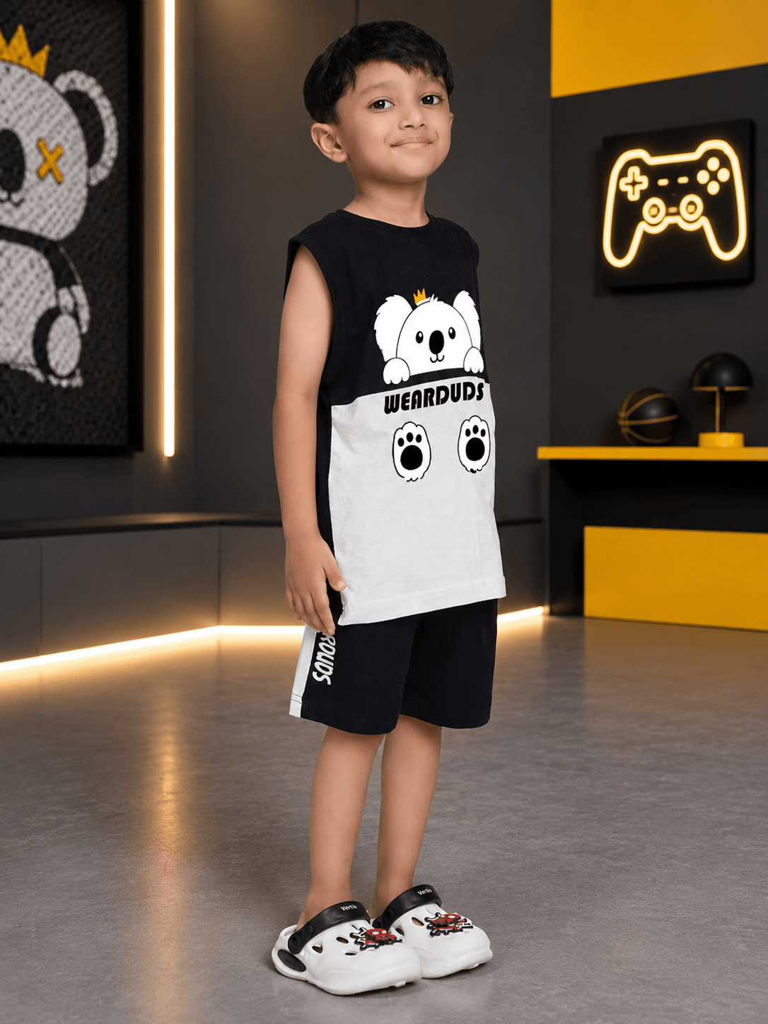 KOALA VIBES CO-ORD FOR BOYS GIRLS BLACK WHITE worn by a boy smiling in a stylish modern setting.