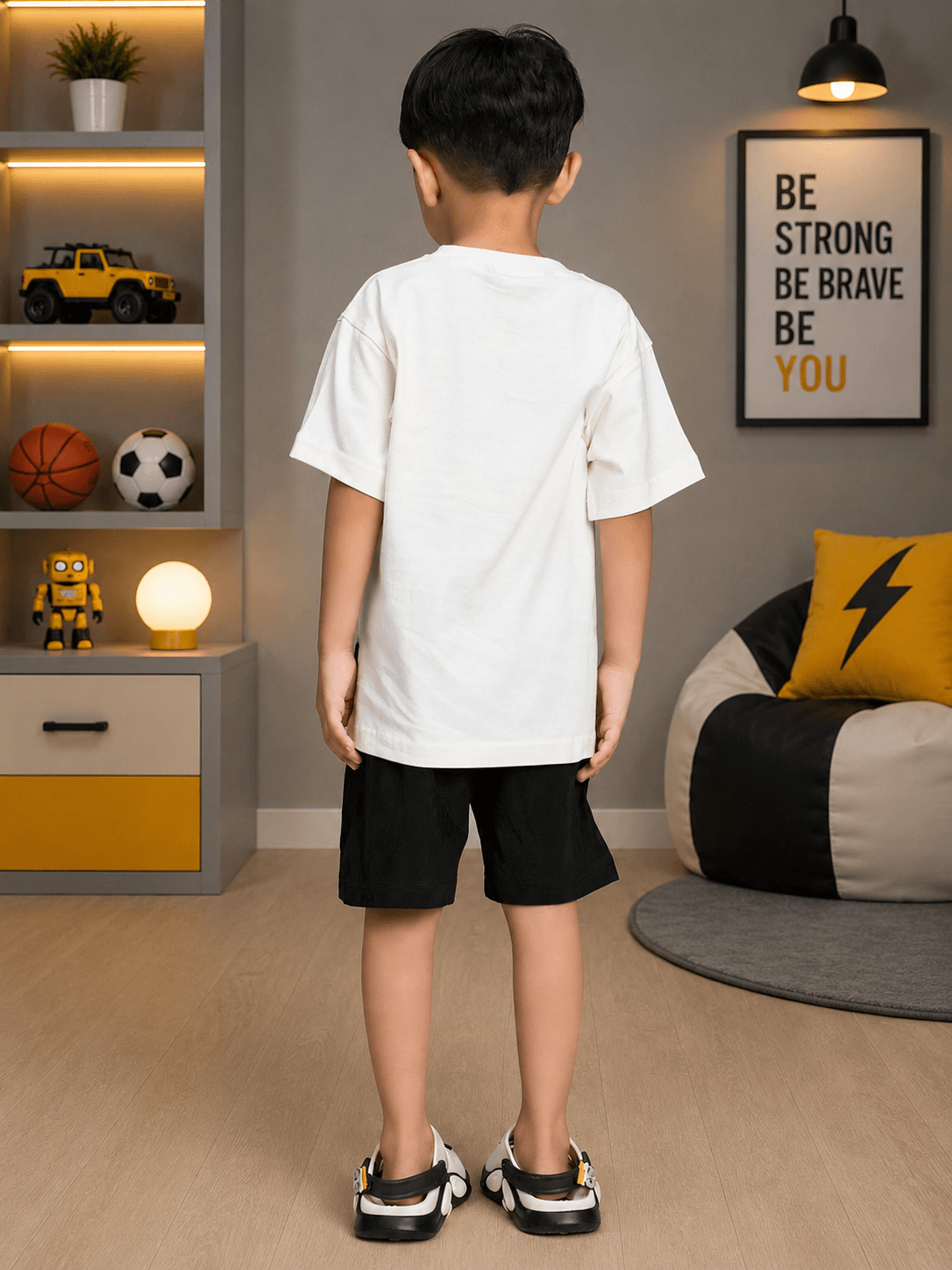 BEAR GRAPHIC CASUAL CO-ORD FOR BOYS GIRLS WHITE BLACK - Back view of a child wearing a bear graphic co-ord.