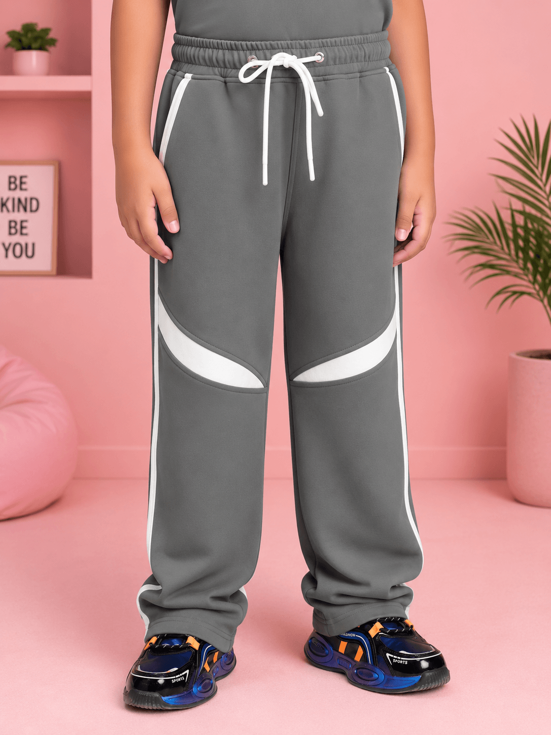 KIDS ROSTER JOGGER FOR BOYS GIRLS GREY WHITE worn by child, featuring sporty style and grey-white color scheme.
