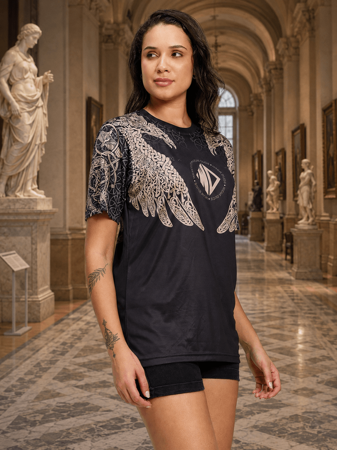 WOMEN AURA OF ASGARD REGULAR T-SHIRT BLACK worn by a woman in a museum setting with statues.