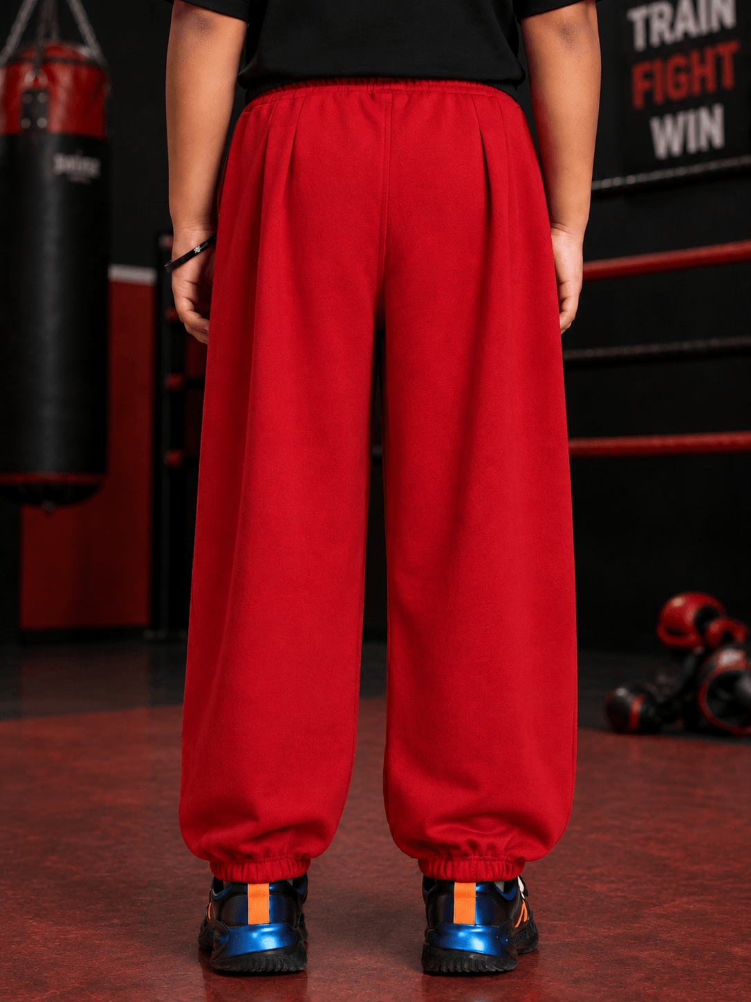 Back view of COOLFIT JOGGER FOR BOYS GIRLS RED showcasing vibrant color and relaxed fit.