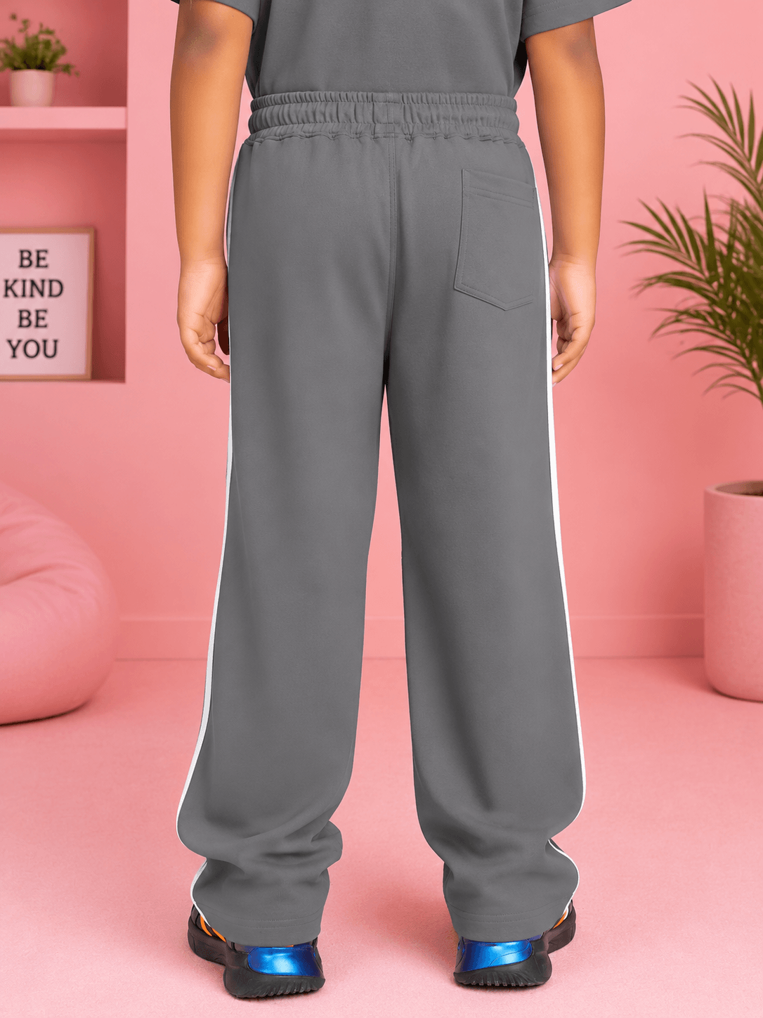 KIDS ROSTER JOGGER FOR BOYS GIRLS GREY WHITE rear view showing grey joggers with white stripes.