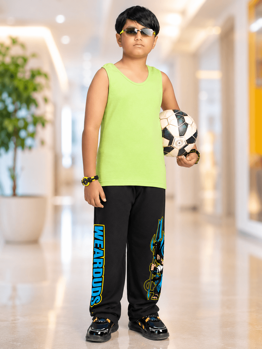 EASY WEAR VEST T-SHIRT FOR BOYS GIRLS NEON GREEN, boy wearing neon green vest with soccer ball, stylish sunglasses.