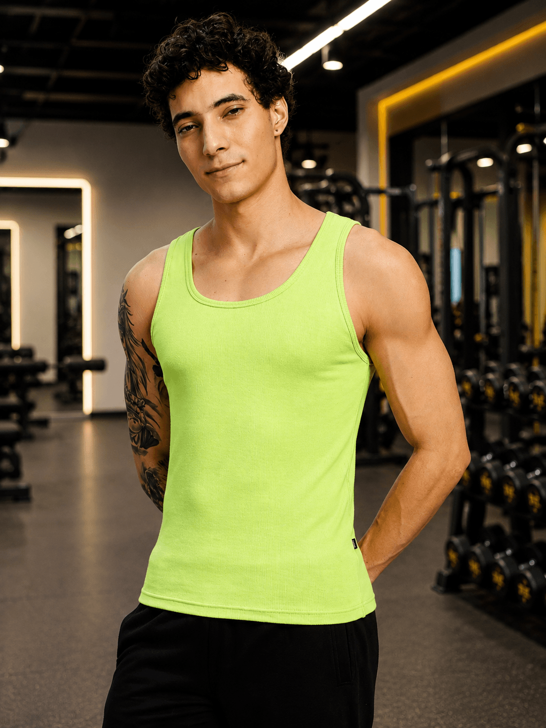 EASY WEAR VEST GYM T-SHIRT NEON GREEN worn by a model in a gym environment