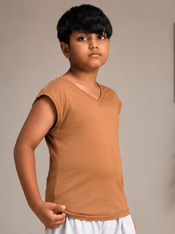 LEVELUP GAMER T-SHIRT FOR BOYS GIRLS BROWN modeled by a boy wearing a brown T-shirt with a modern fit.