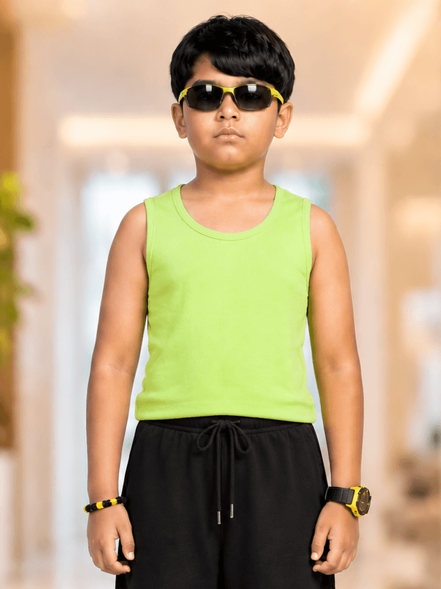 EASY WEAR VEST T-SHIRT FOR BOYS GIRLS NEON GREEN modeled by a boy wearing sunglasses and black shorts.
