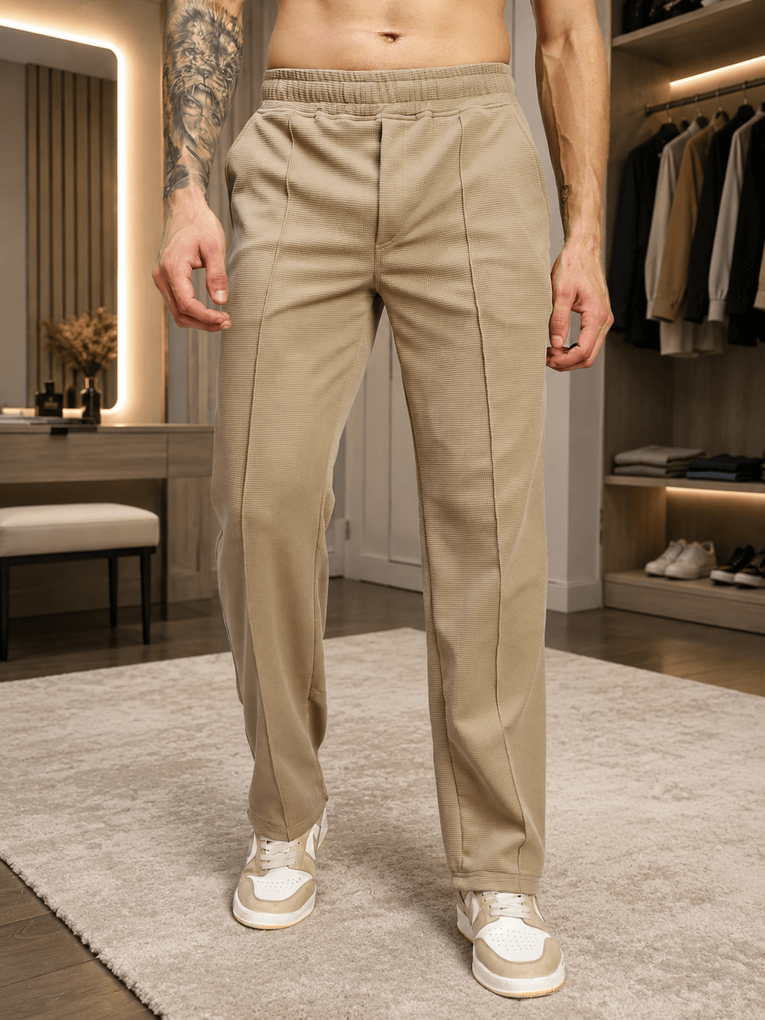ELITE TEXTURED FIT JOGGERS BEIGE displayed on a model in a stylish setting, showcasing their modern design and tailored fit.