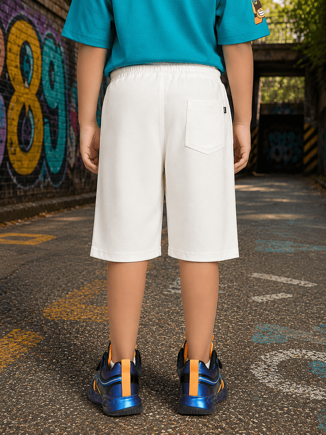 JUNIOR SHORTS FOR BOYS GIRLS WHITE viewed from the back, showcasing comfort and style for kids.