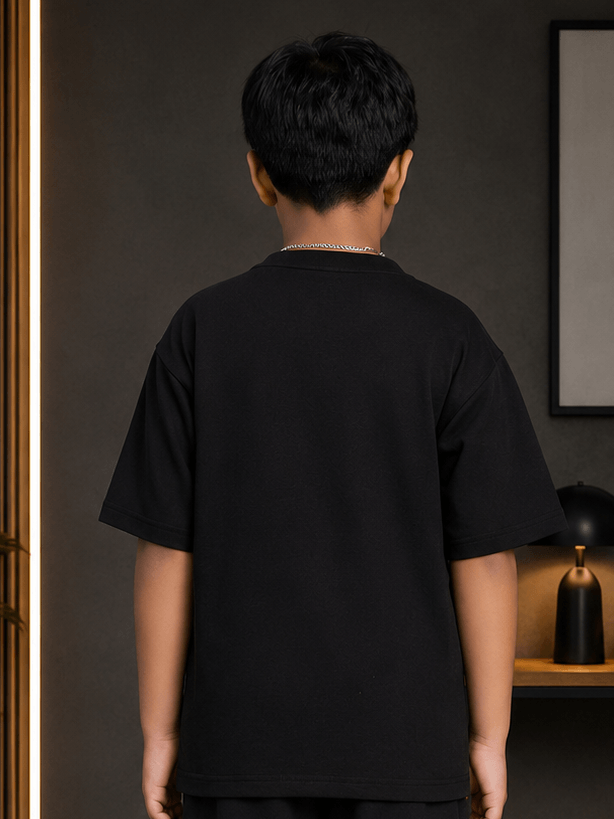 Back view of YOUTH CONTREST PIPING T-SHIRT FOR BOYS GIRLS BLACK on a child, showcasing its sleek design.