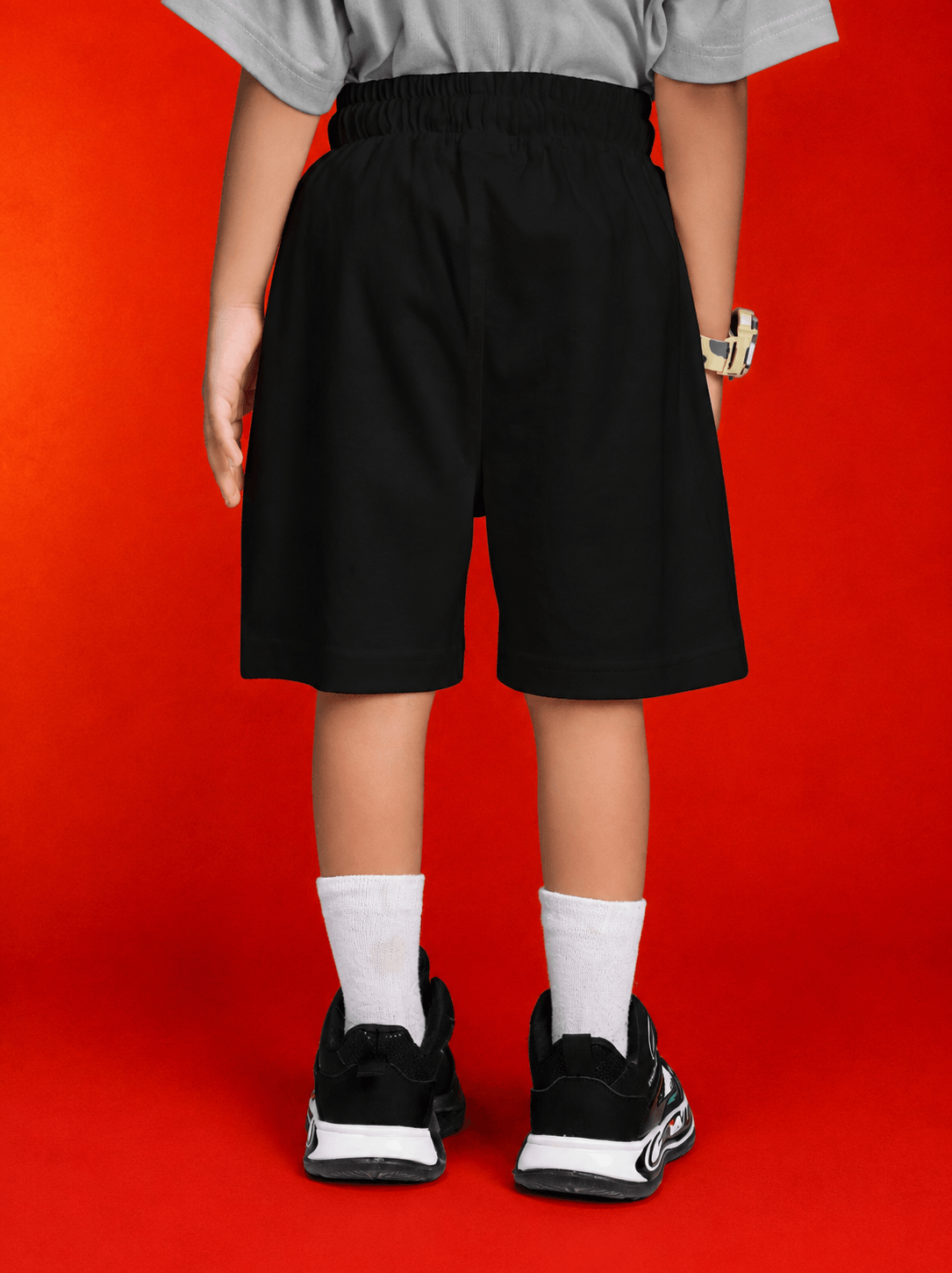 Boy wearing ROBLOX WORLD FIT SHORTS FOR BOYS GIRLS BLACK, back view, stylish and comfortable design.