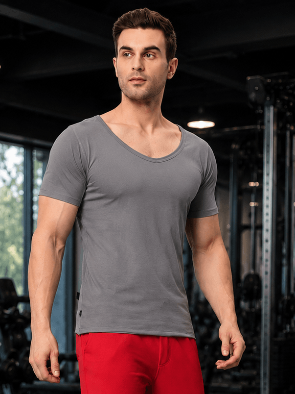 RICKY REGULAR FIT T-SHIRT GREY worn by a model in a fitness setting, showcasing casual style and comfort.