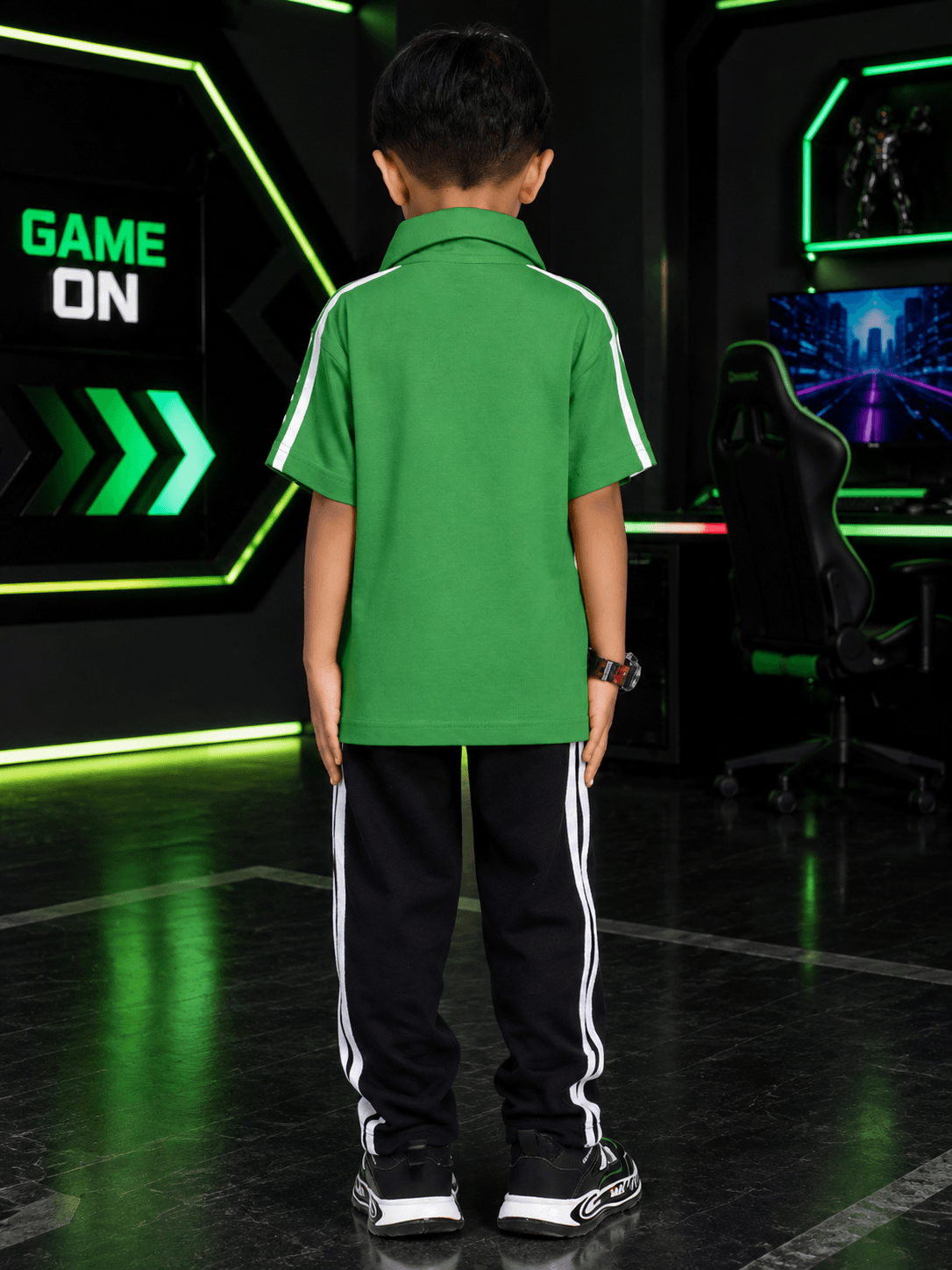 CHAMPION TRACK POLO CO-ORD FOR BOYS GIRLS GREEN BLACK back view of a child wearing green polo and black pants.