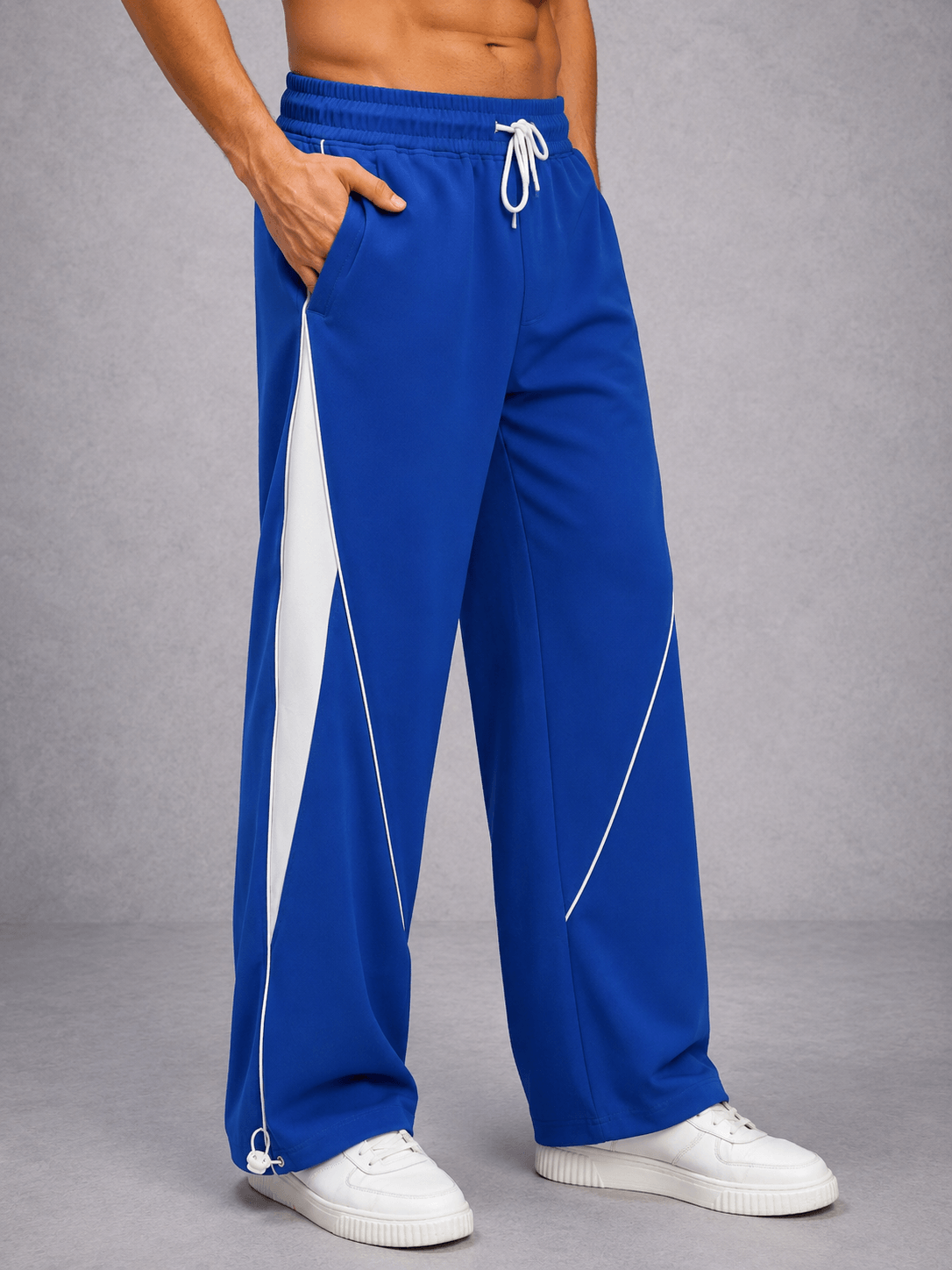 BOLD ELECTRIC RELAXED-FIT JOGGERS BLUE showcasing a modern relaxed silhouette in vivid blue with white details.