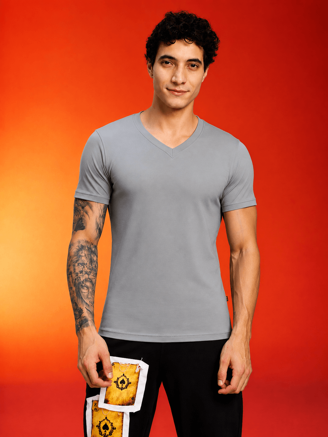 CORE SHORT REGULAR FIT T-SHIRT GREY displayed on a model with a vibrant background.