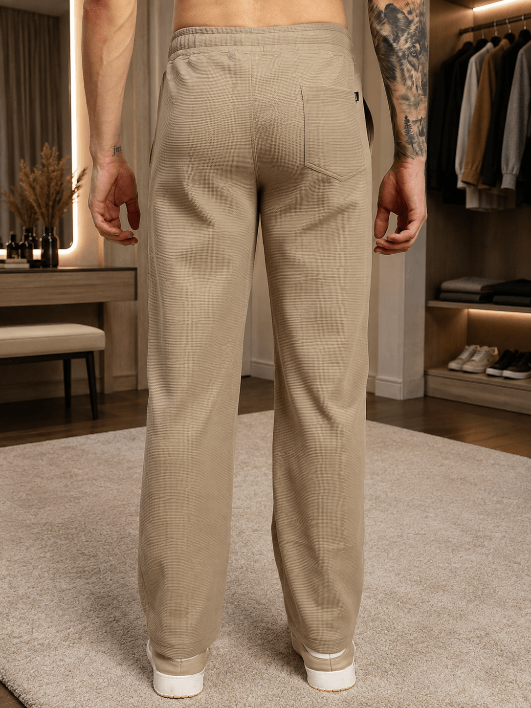 ELITE TEXTURED FIT JOGGERS BEIGE shown from the back, featuring a tailored fit and soft beige color.