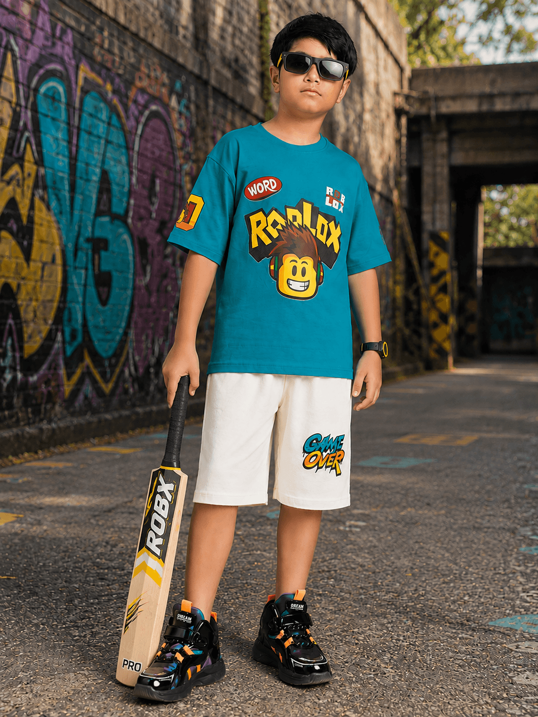 JUNIOR CO-ORD FOR BOYS GIRLS BLUE WHITE stylish outfit for kids featuring blue t-shirt and white shorts.