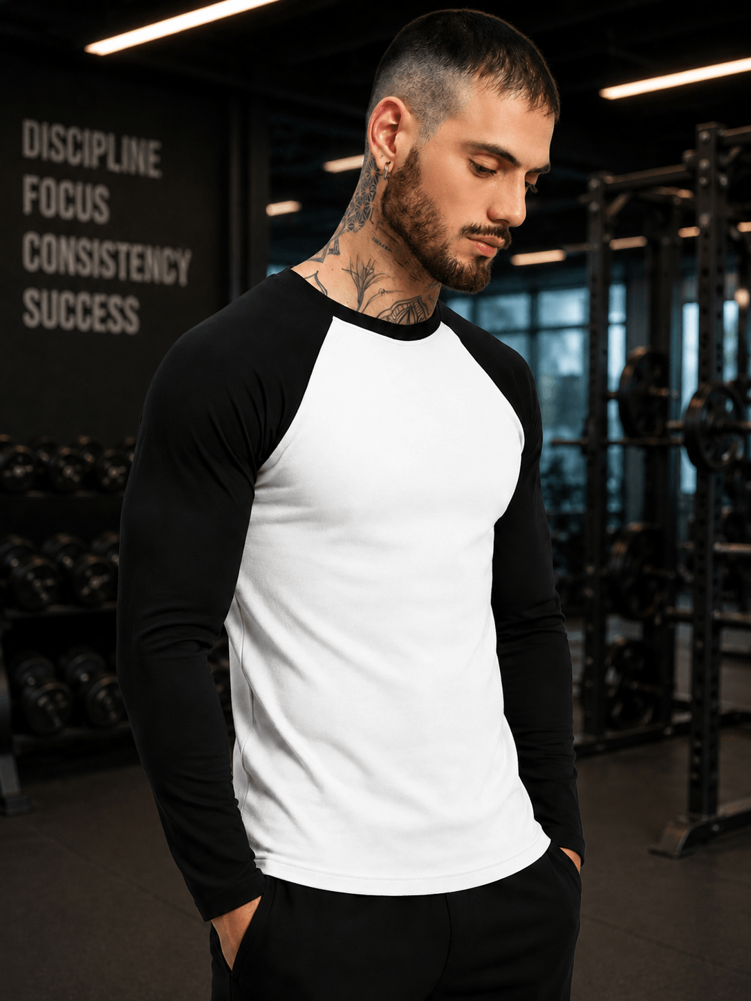 FITFLOW SLIM FIT SWEATSHIRT WHITE BLACK worn by a man in a gym setting, highlighting its athletic design and comfort.