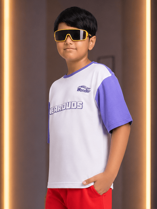 STREET WONDER T-SHIRT FOR BOYS GIRLS WHITE modeled by a boy wearing stylish sunglasses and colorful shorts.