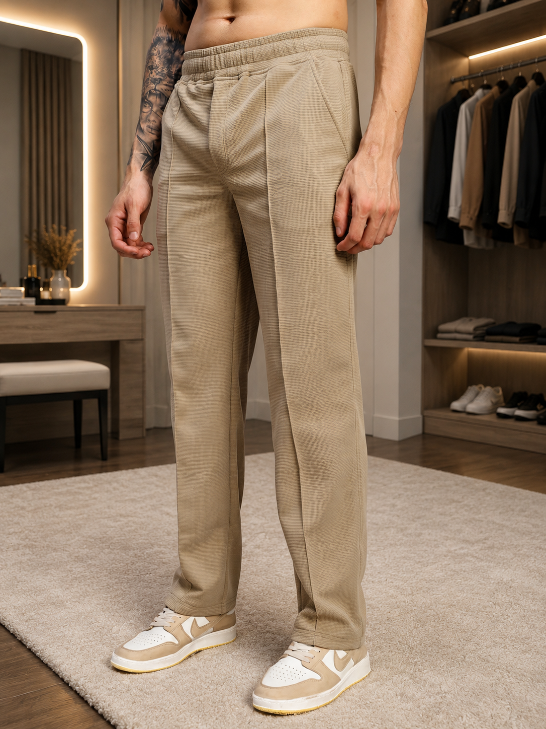 ELITE TEXTURED FIT JOGGERS BEIGE shown in a stylish indoor setting, highlighting the tailored fit and modern design.