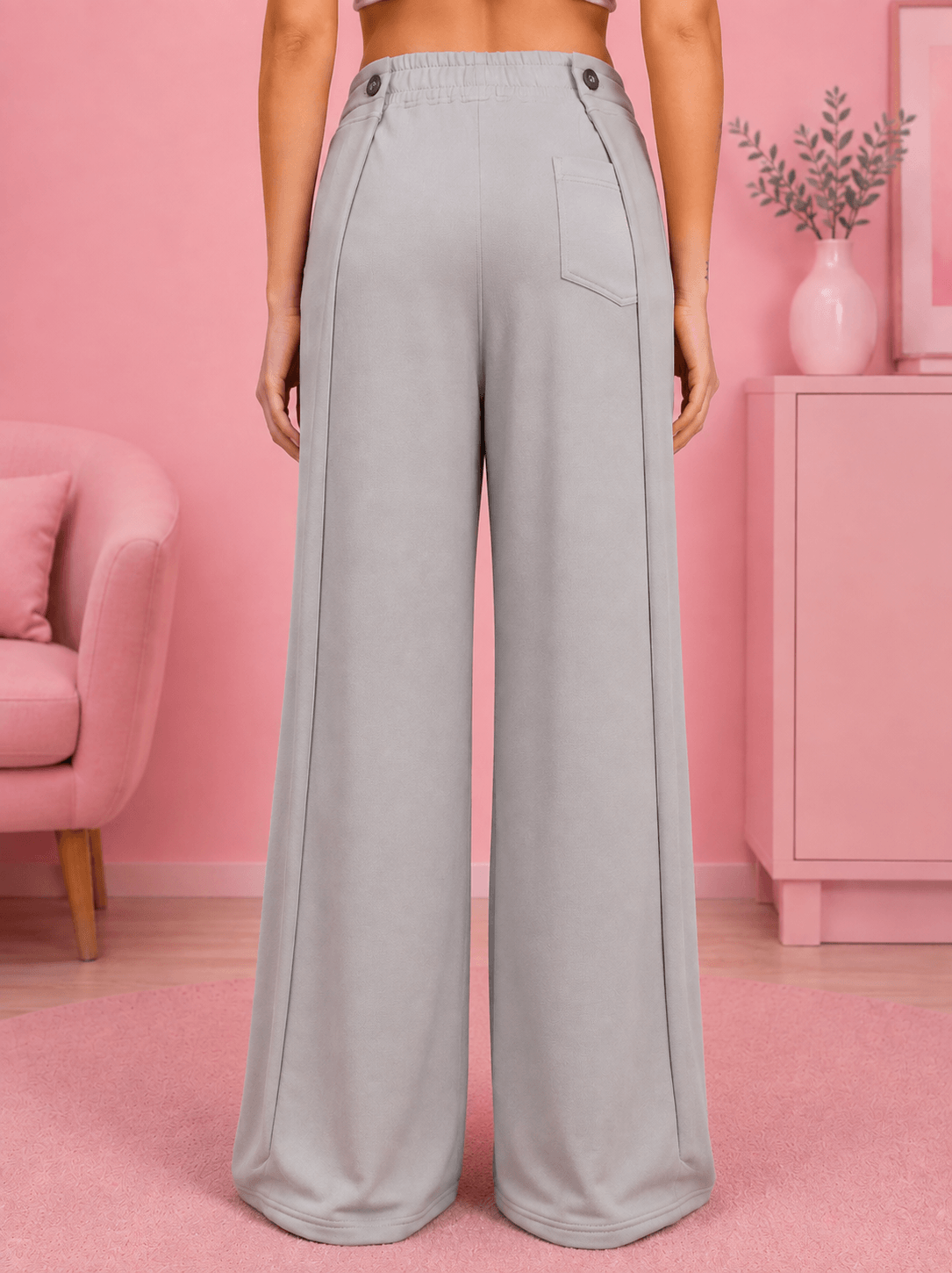 WOMEN OMEGA FLOW WIDE FIT JOGGERS GREY showcased from the back, featuring a wide-fit silhouette in a stylish grey shade.