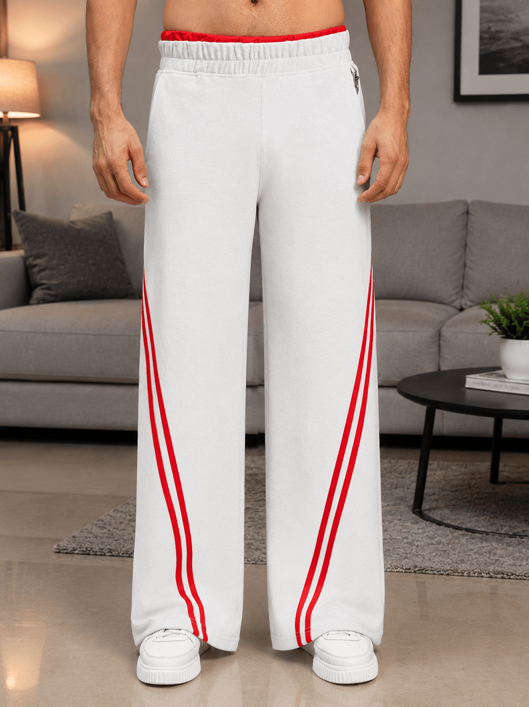 SNOW STREETWEAR BAGGY JOGGERS MELANGE GREY worn in a stylish setting with red stripes and relaxed fit.