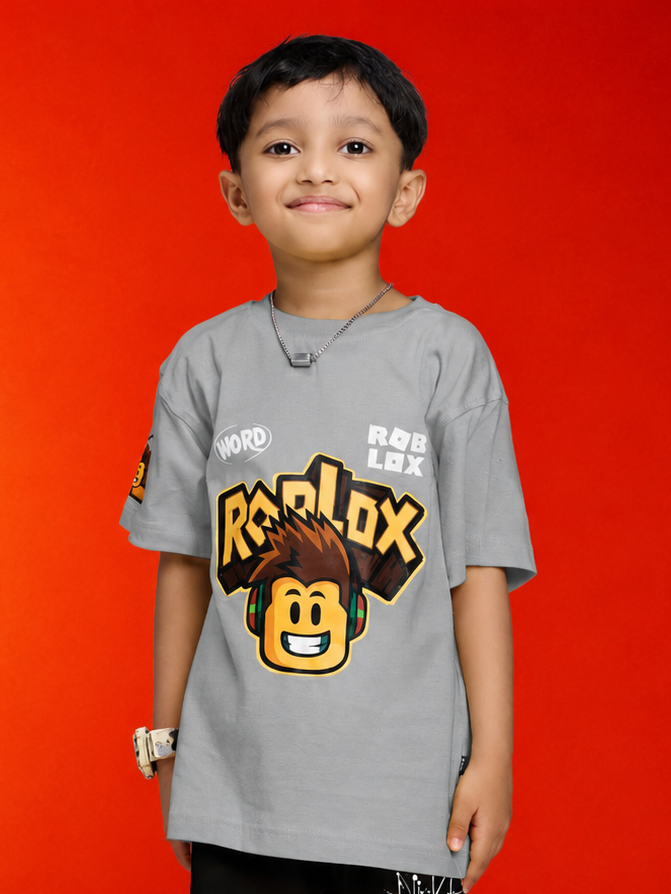 ROBLOX WORLD FIT T-SHIRT FOR BOYS GIRLS GREY worn by a smiling boy against a bright orange background.
