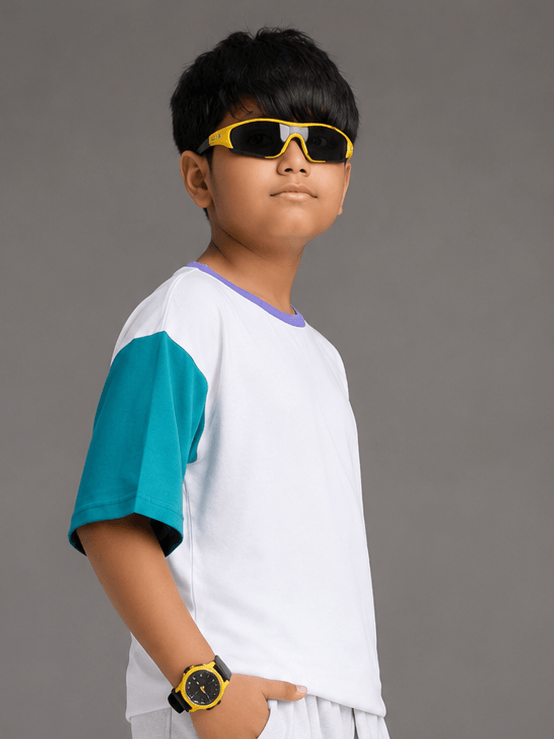 CHILL T-SHIRT FOR BOYS GIRLS WHITE MULTI worn by a boy wearing sunglasses, showcasing a trendy kids' fashion style.
