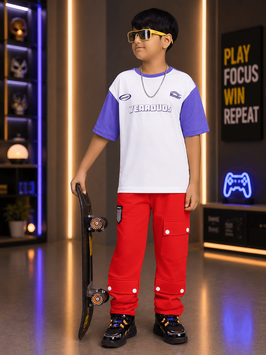 STREET WONDER CO-ORD FOR BOYS GIRLS WHITE RED outfit worn by a boy holding a skateboard in a modern setting.