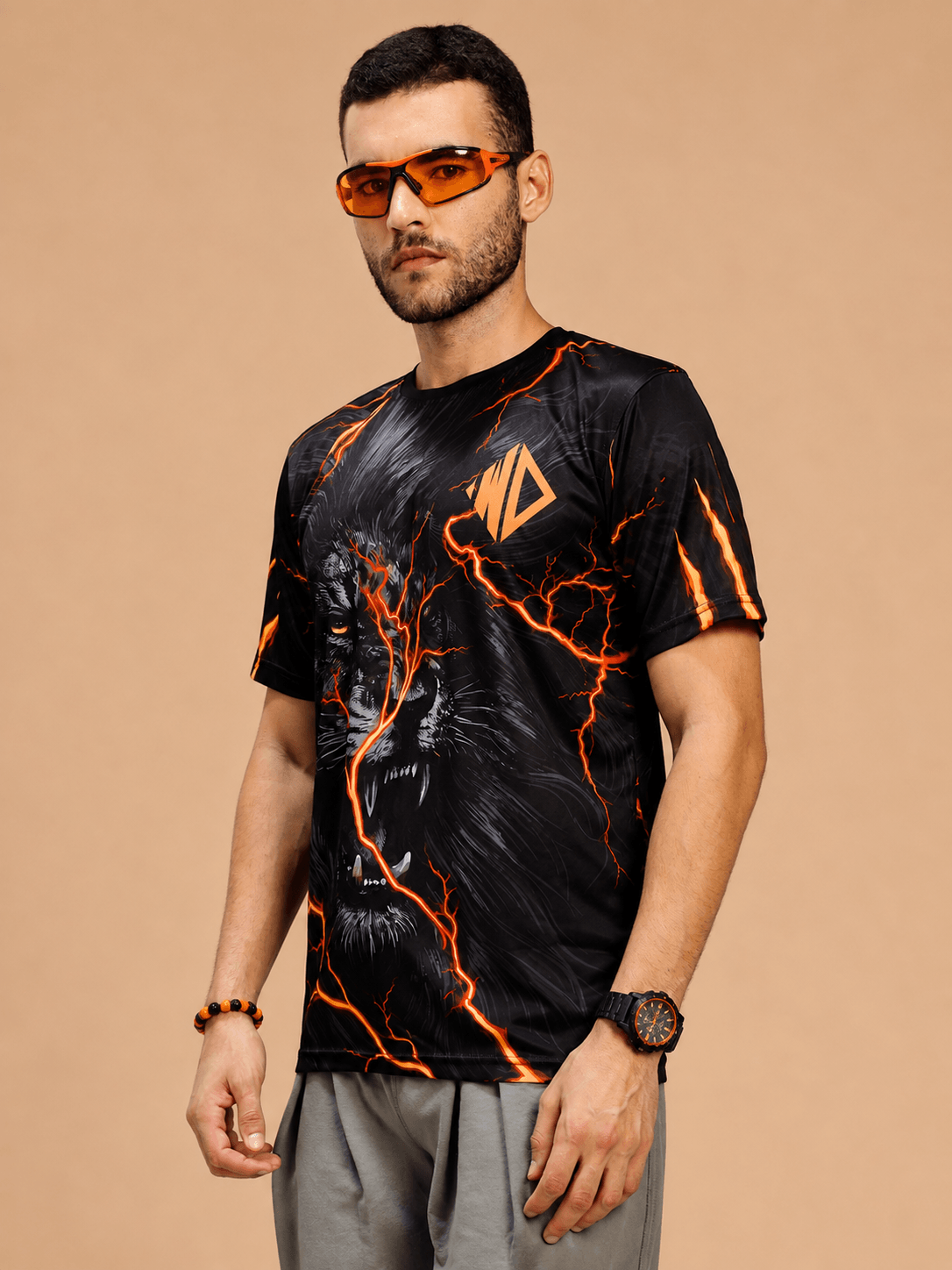 WILD LIFE POWER GRAPHIC RUNNING T-SHIRT BLACK ORANGE featuring bold graphic design and vibrant orange accents.