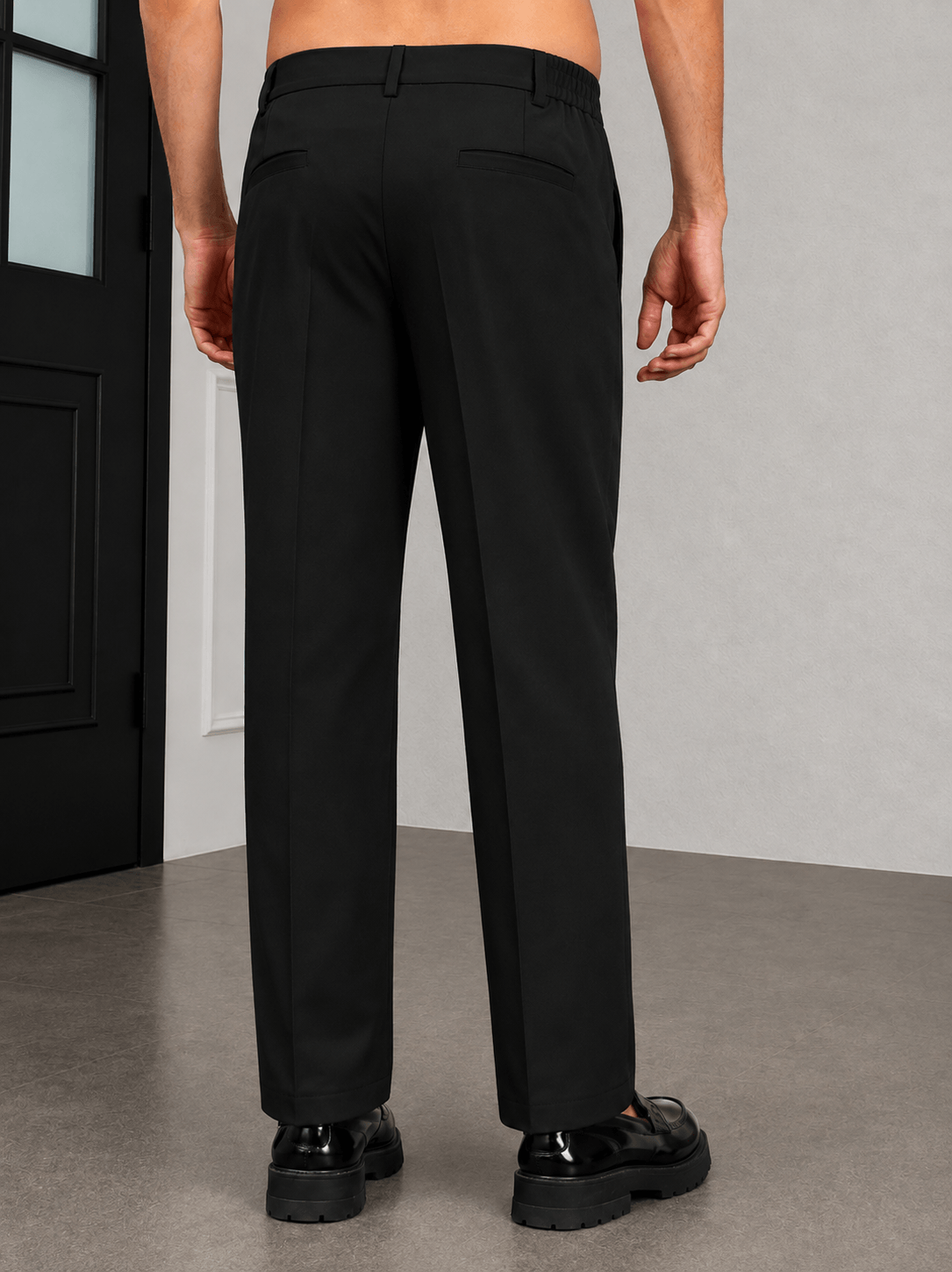 HIGH-FLEX TAILORED PANTS DARK BLACK viewed from the back, showcasing sleek design and high-flex comfort.
