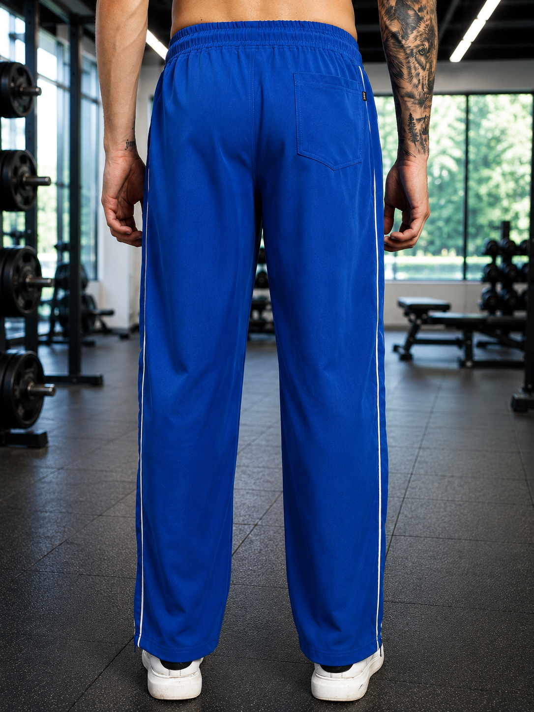 Back view of a person wearing RELIGHT RELAXED FIT CO-ORD SET BLUE in a gym setting.