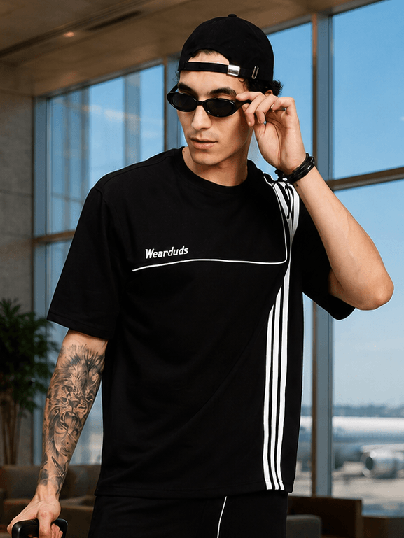 YOUTH CONTREST PIPING T-SHIRT BLACK modeled by a young man wearing sunglasses indoors