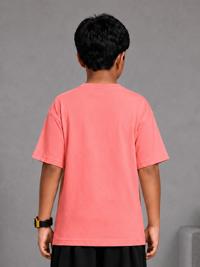Back view of a child wearing a COOLFIT T-SHIRT FOR BOYS GIRLS PINK, showcasing its vibrant color.